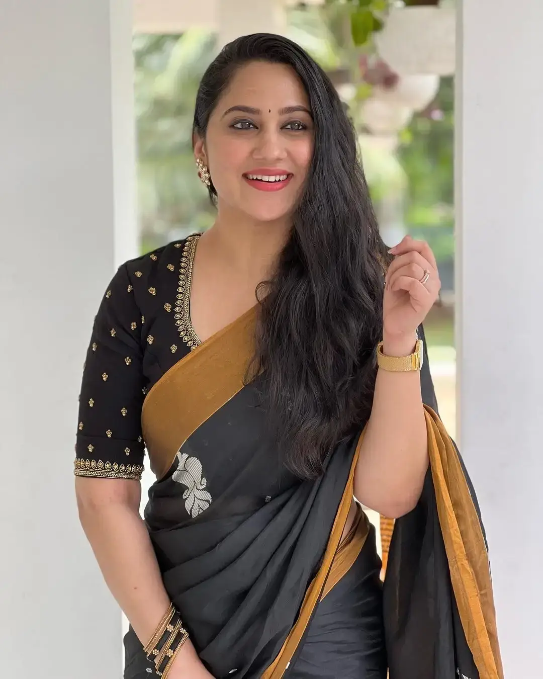 Beautiful Indian Queen Miya George in Traditional black Saree